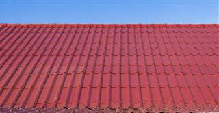 Red roof against blue sky