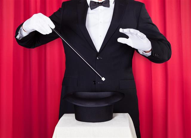 Young Magician In A Black Suit