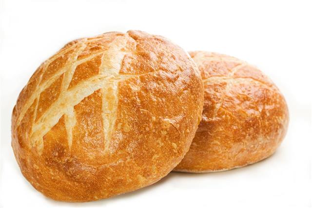 Freshly baked round Italian loaves of bread