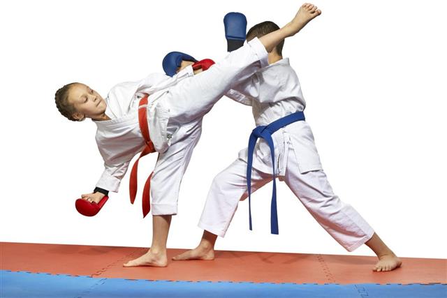 Two young athlete doing exercise karate