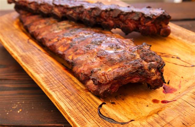Barbecue Spareribs on wooden background