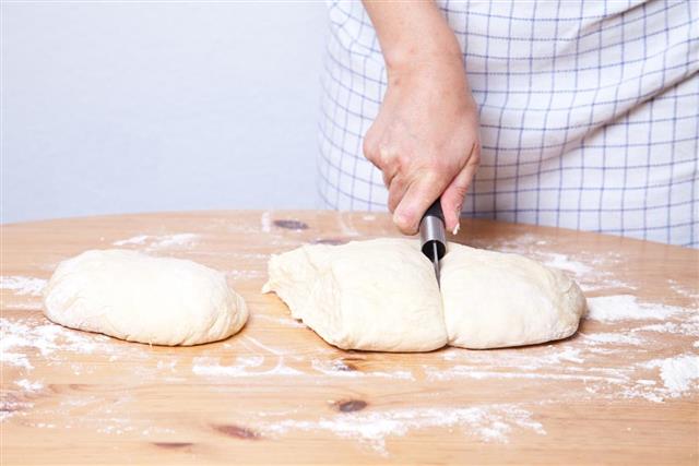 cutting dough into equal pieces