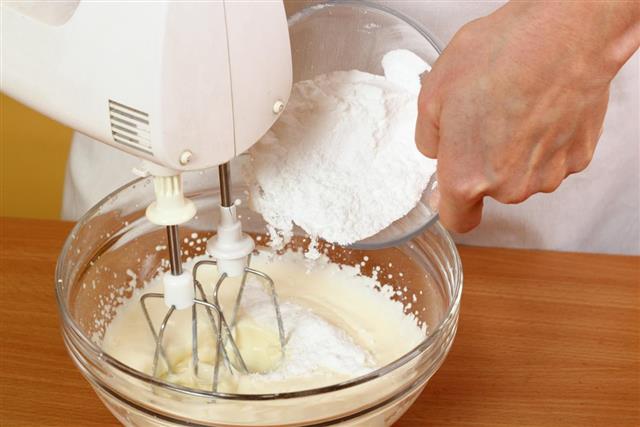 adding flour into mixture