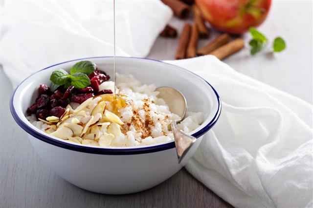 Breakfast rice porridge with almonds and cranberry