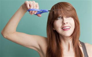Woman Cutting Her Own Hair