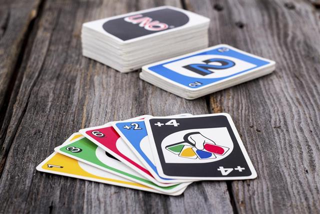 Uno card game on wood table