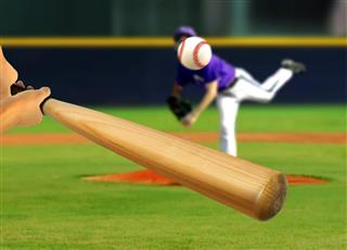 Baseball Pitcher Throwing Ball to Batter