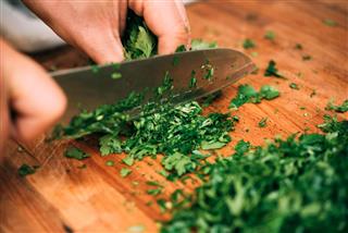 Cutting parsley in a kitchen
