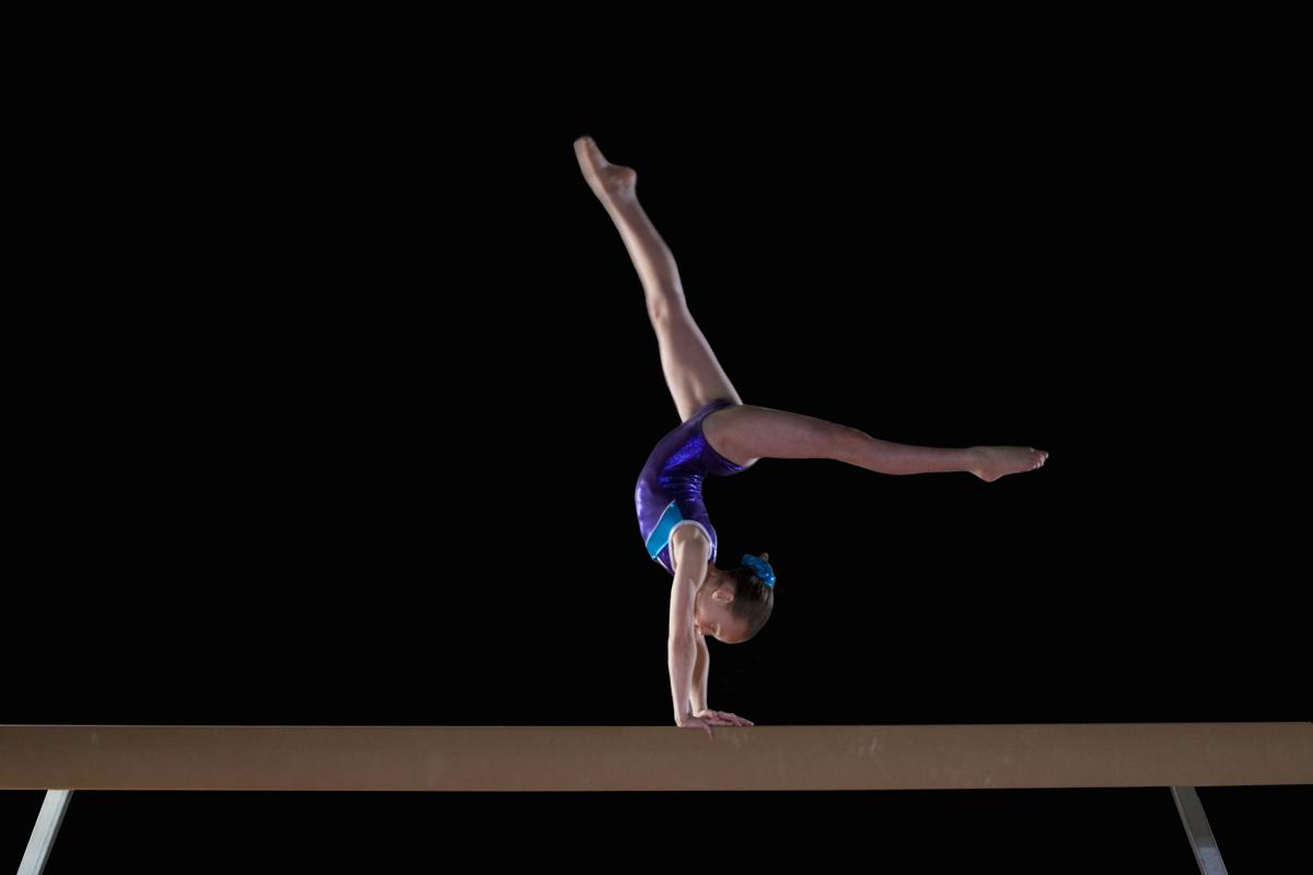 An Introduction To The Basic Moves On The Balance Beam In Gymnastics