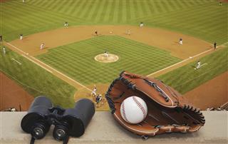 Binoculars and a baseball glove
