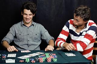 young people playing poker off-line tournament, friends party