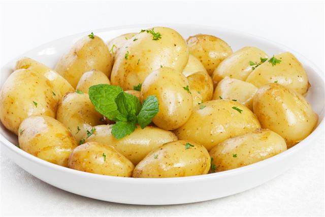 potatoes in butter with parsley and mint