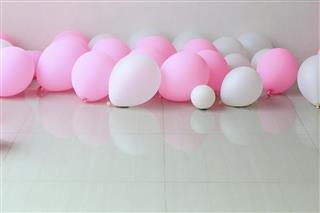 Pink and White Balloons on the Floor