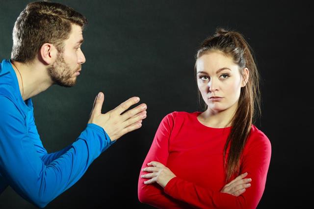 Regretful man husband apologizing upset woman wife
