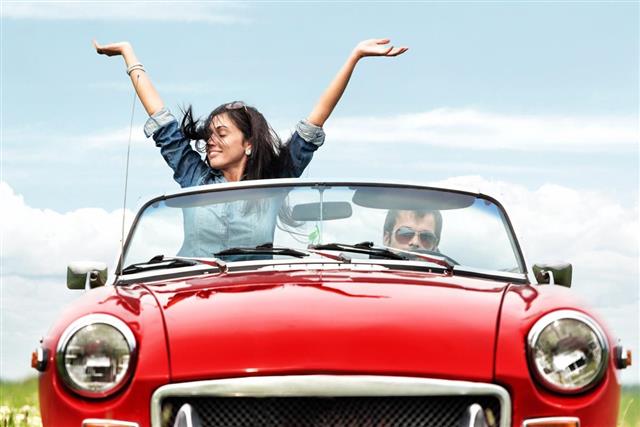 Happy young people in a cabriolet