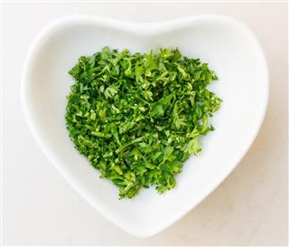 Images    Photos    Illustrations    VideoChopped parsley in heart shaped bowl