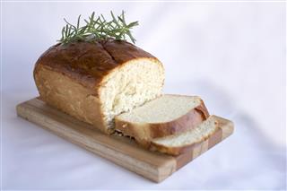 Delicious homemade white bread on wood cutting board