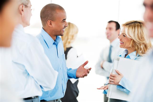successful business people standing and talking