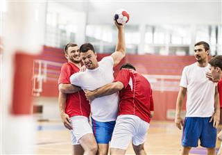 Male handball players in action