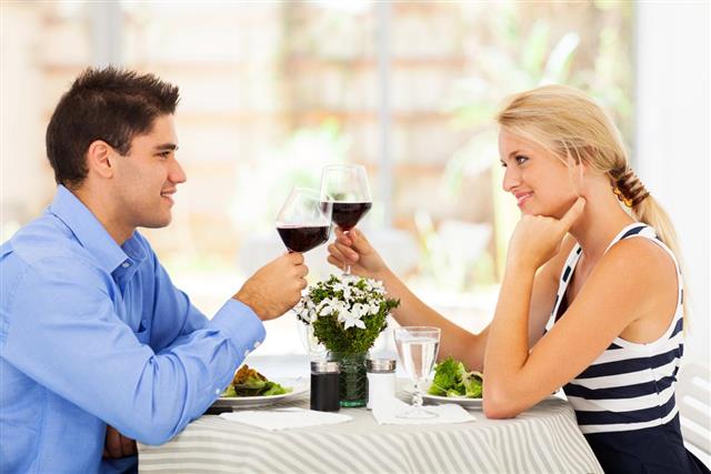 Young couple drinking wine in restaurant