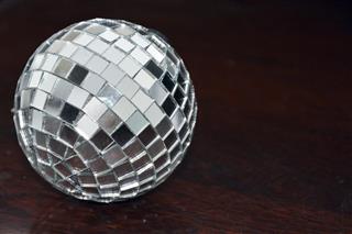 Disco ball on wooden table