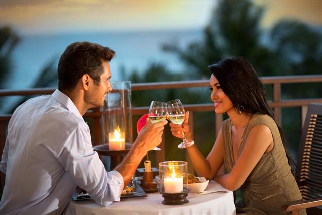 Romantic couple toasting during dinner