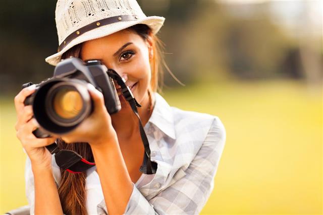 young woman taking pictures