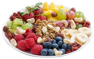 berries, fruits, nuts and granola, products for healthy breakfast