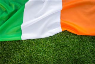 Irish flag on green grass