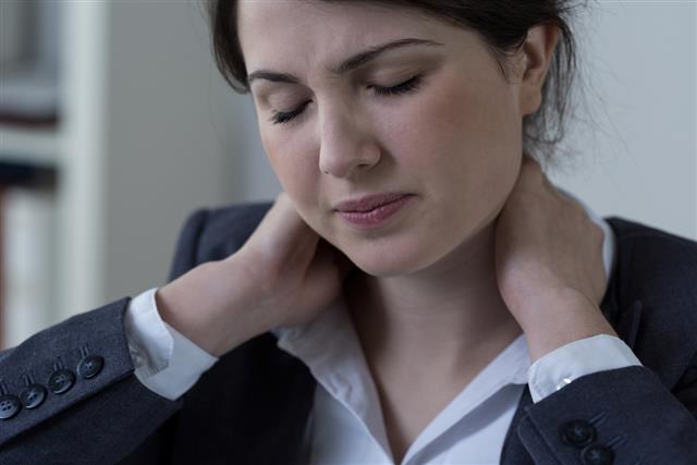 Neck pain, caused by incorrect sitting position at her desk