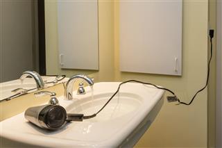 Electrocution risk from hair dryer near sink