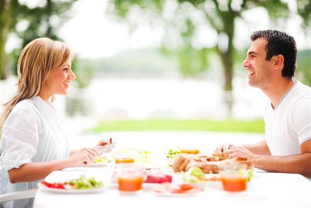 Couple having dinner outdoors