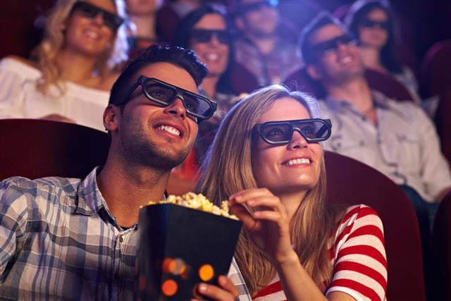 Happy couple in 3D movie