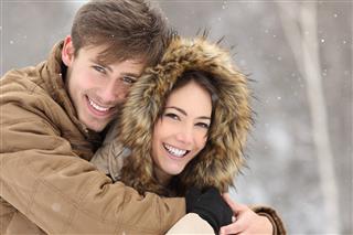 Couple laughing with a perfect smile and white teeth