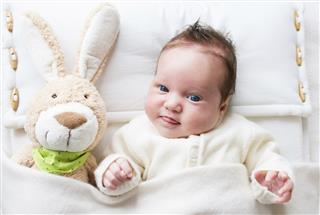 Sweet baby with toy bunny