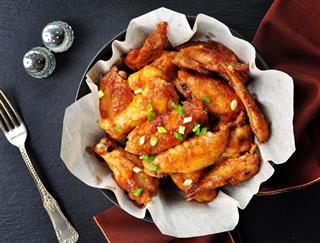 Chicken wings fried in soy sauce, rice vinegar, honey