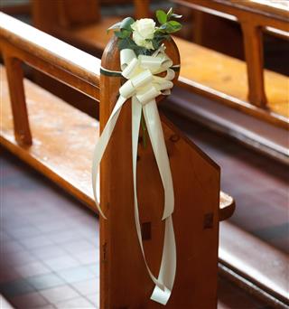 bows and flowers for decorating the pews