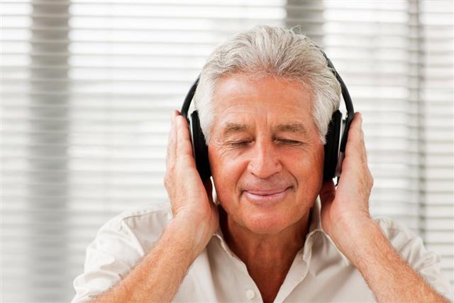 Senior man listening to music