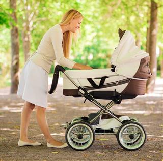 mother with baby stroller