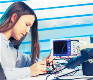 Girl repairing electronic device