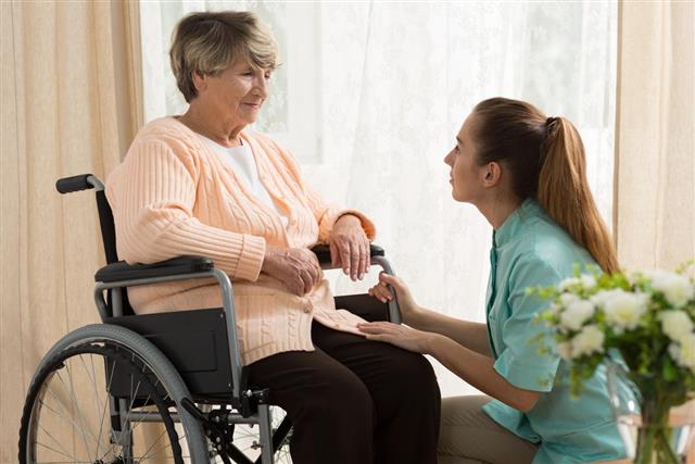 Caregiver helping old female