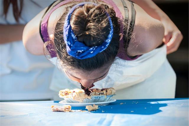 Young Girl Competing in Pie Eating Contest