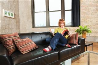 Adult Relaxing in Loft Apartment Home