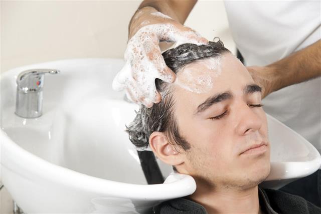 Young man in the hair salon