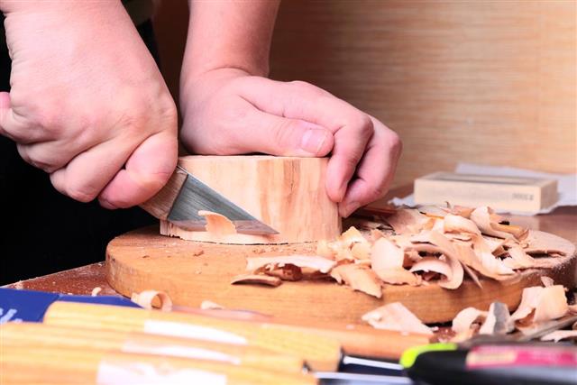 Carpenter hand carving wood