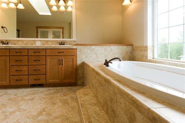 Luxury bathroom with travertine floors