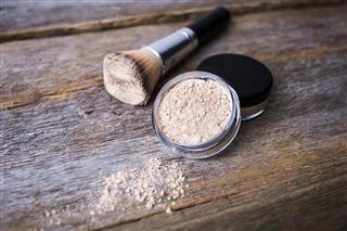 mineral powder of different colors with a brush for makeup