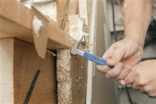 Carpenter Using a Nail Puller