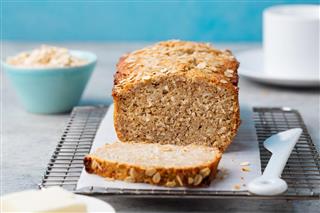 Healthy vegan oat, coconut loaf bread, cake on cooling rack