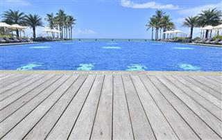 Luxury infinity swimming pool at tropical resort